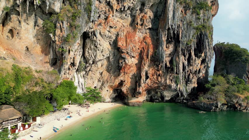 Aerial view of Railay Beach with dramatic limestone cliffs, turquoise waters, and white sand in Krabi, Thailand