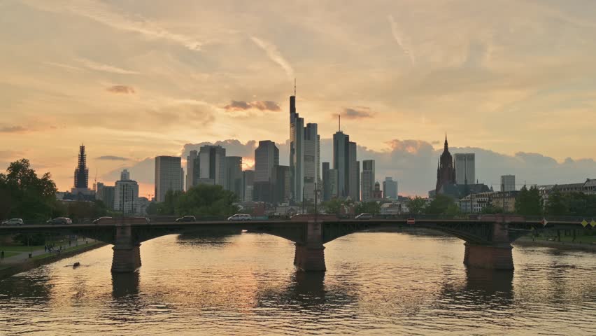Skyline of Frankfurt am Main with Skyscrapers Reflected in the Golden Main River – Germany	