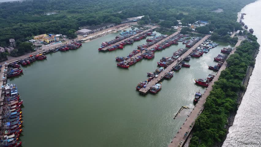  Aerial Shot of fishing harbor and locals working and enjoying the Hussle of the estuary.