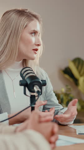 Host, podcast and woman talking with microphone for show, storytelling and interview. Broadcast, guest and influencer recording audio, content creation and live streaming in studio with discussion