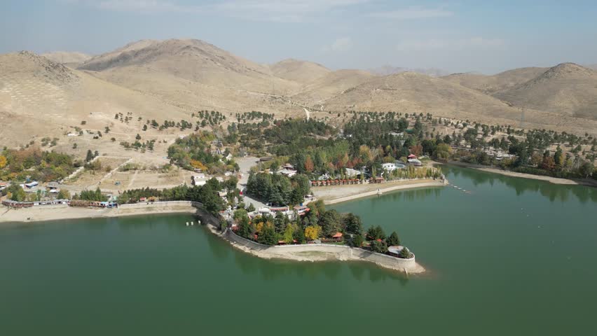 Drone over Qargha Water Reservoir, West of Kabul, Afghanistan. Drone Shot of Lake, Lakefront Buildings and Landscape