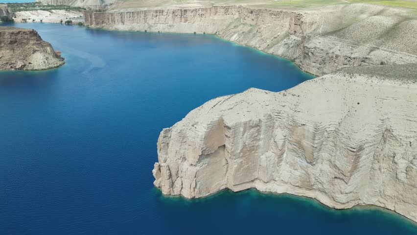 Band E Amir Drone Aerial, Afghanistan. Pristine turquoise lake oasis, lush trees in desert landscape