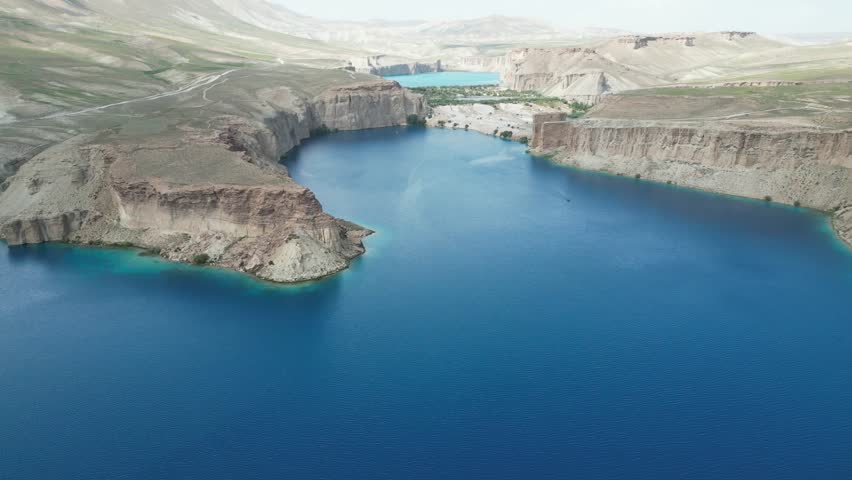Band E Amir Drone Aerial, Afghanistan. Pristine turquoise lake oasis, lush trees in desert landscape