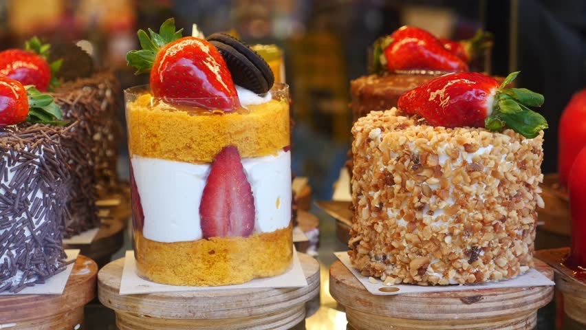 A Close-up of Delicious Mini Cakes Decorated with Strawberries 4k