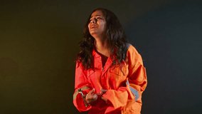 Crying criminal lady tries removing metal cuffs, Troubled female detainee pulls hard at tight shackles, Open haired girl twists arms to break chain in frustration, Captive woman shouting for help - Powered by Shutterstock - Get 15% off with code: PIKWIZARD15