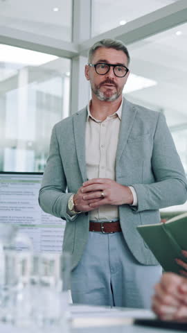 Business, presentation and man in meeting, talking and financial agency with speaker. Presenter, employee and mature person in office, conversation or feedback for company audit, leadership or report