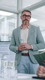 Business, presentation and man in meeting, talking and financial agency with speaker. Presenter, employee and mature person in office, conversation or feedback for company audit, leadership or report - Powered by Shutterstock - Get 15% off with code: PIKWIZARD15