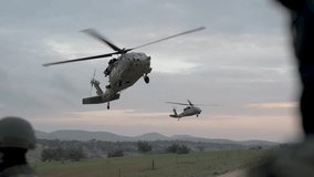Cinematic aerial view of a helicopter and soldiers performing a military medical evacuation training exercise
 - Powered by Shutterstock - Get 15% off with code: PIKWIZARD15