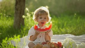 Cute little kid eating watermelon on summer picnic. Happy child concept. - Powered by Shutterstock - Get 15% off with code: PIKWIZARD15