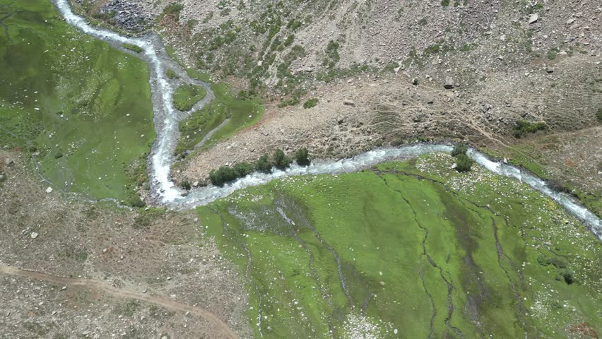 Silk road Aerial drone, Afghanistan River valley , green mountains top down in Nuristan National Park
