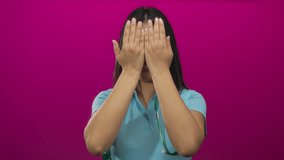 Young woman doctor smiling holding stethoscope against pink isolated background showcasing healthcare professionalism and cheerful demeanor. - Powered by Shutterstock - Get 15% off with code: PIKWIZARD15