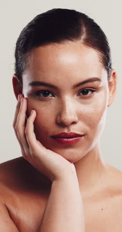 Face, beauty and woman in studio, skincare and dermatology on white background. Aesthetic, cosmetics and person with healthy skin, grooming and shine with glow, lipstick and wellness with makeup