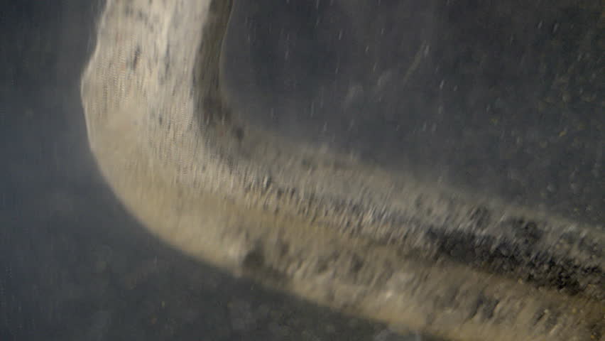 New, silvery metal forming on c-clamp during electrolytic cleaning.