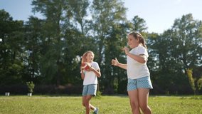 American children playing ball. American football sports concept. American football with children playing in park. American football player and his lifestyle children playing football in park. - Powered by Shutterstock - Get 15% off with code: PIKWIZARD15