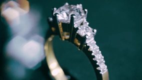 Extreme close-up of a sparkling diamond ring rotating against a dark background. Luxurious and detailed jewelry concept perfect for engagement, wedding, and high-end product visuals. - Powered by Shutterstock - Get 15% off with code: PIKWIZARD15