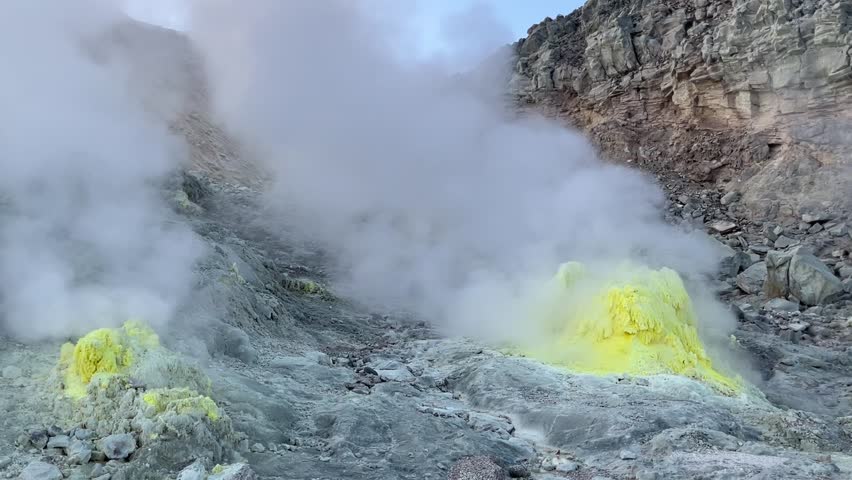 Clouds of steam erupting from sulphur vent inside volcano crater, Mt. Io, Hokkaido, Japan