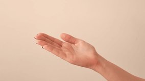 Caucasian woman wraps her arm and hand with a white elastic bandage. Treatment of injuries and sprains. Close-up - Powered by Shutterstock - Get 15% off with code: PIKWIZARD15