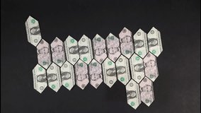 Financial projections 2025, folded US dollar bills creating the year 2025 in stop motion animation - Powered by Shutterstock - Get 15% off with code: PIKWIZARD15
