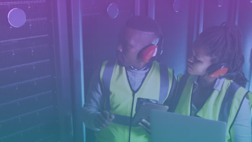 Engineers tapping tablet in server room showing overlay progressing to 100% while pointing hardware. Technology, collaboration, data, industrial, digital, innovation, analysis - Powered by Shutterstock - Get 15% off with code: PIKWIZARD15