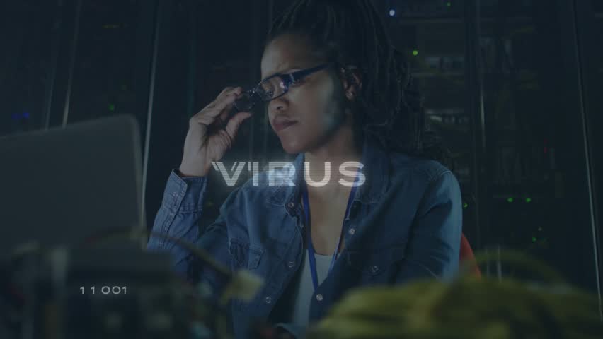 Female security analyst refocusing laptop in server room, with HUD showing flashing VIRUS warning. Technology, cybersecurity, data protection, digital interface, professional, industrial, monitoring - Powered by Shutterstock - Get 15% off with code: PIKWIZARD15