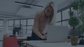 Female business user typing on laptop and showing pulsing transfer overlay receiving encrypted data. Technology, digital, professional, modern, secure, innovative, workspace - Powered by Shutterstock - Get 15% off with code: PIKWIZARD15