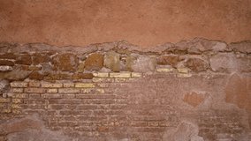 Old brick and plaster wall texture in warm terracotta and yellow tones, sharp detail for facade building; background copyspace template virtual. - Powered by Shutterstock - Get 15% off with code: PIKWIZARD15