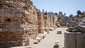 Ephesus ancient ruins softly blurred sunlit textured weathered stone path; background backplate copyspace calm. - Powered by Shutterstock - Get 15% off with code: PIKWIZARD15