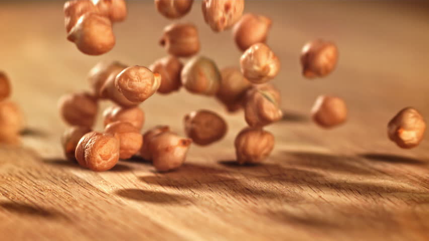 Chickpeas fall on the table. Filmed on a high-speed camera at 1000 fps. High quality FullHD footage
