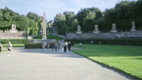 Defocused formal garden view in florence with shallow bokeh background, distant obelisk and terraced stone steps; background backdrop copyspace. - Powered by Shutterstock - Get 15% off with code: PIKWIZARD15