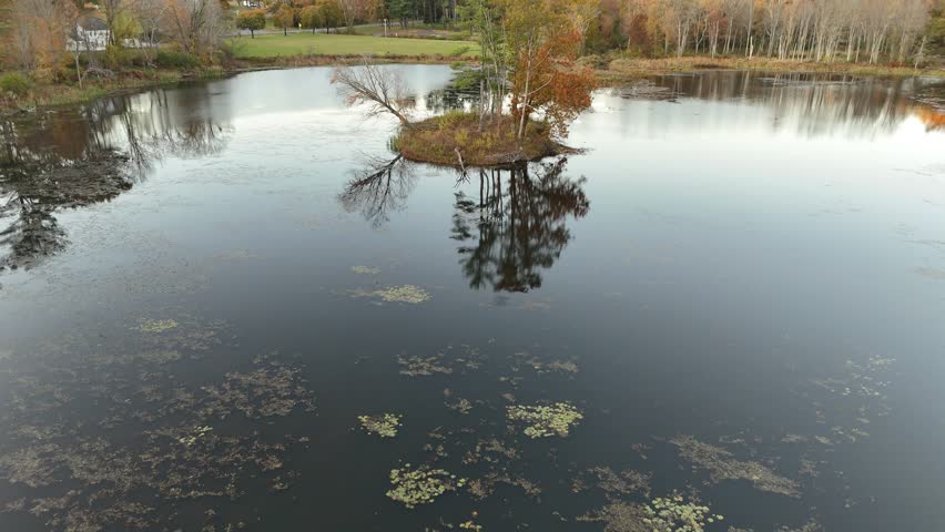 Southbury, Connecticut. 10-21-2025. Aerial view of a serene lake in Southbury, Connecticut, surrounded by lush trees and peaceful nature—ideal for themes of tranquility and outdoor beauty.
