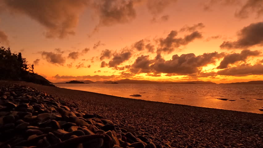 Timelapse of a golden sunrise over the Whitsunday Islands, Queensland Australia