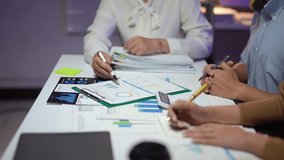 Professional business team analyzing financial reports, discussing market trends, and strategizing collaborative growth in modern corporate office setting - Powered by Shutterstock - Get 15% off with code: PIKWIZARD15