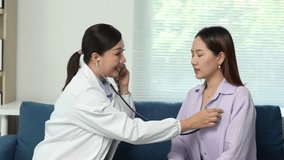 Professional female physician listening carefully to patient's lungs during comprehensive medical checkup in modern clinic setting, using stethoscope for precise respiratory assessment - Powered by Shutterstock - Get 15% off with code: PIKWIZARD15