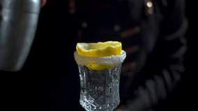 Pour the Brandy Crusta cocktail through the shaker into a tall champagne glass with a sugar rim and lemon peel. - Powered by Shutterstock - Get 15% off with code: PIKWIZARD15