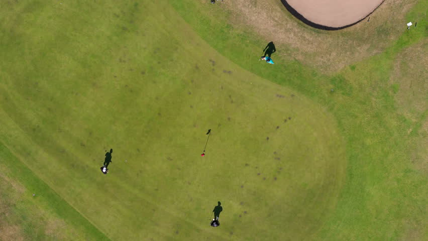 Nottingham, UK, 12-05-2025: Top down aerial view of people playing golf at Wollaton Park Golf Course on the grounds of Wollaton Hall and Deer Park in Nottingham.