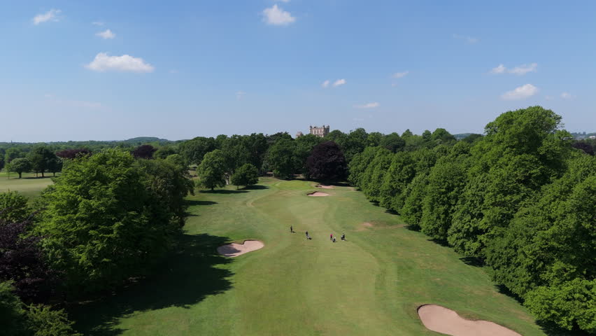 Nottingham, UK, 12-05-2025: Aerial views of people playing golf at Wollaton Park Golf Course on the grounds of Wollaton Hall and Deer Park in Nottingham.