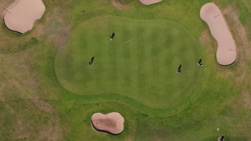 Nottingham, UK, 12-05-2025: Top down aerial views of people playing golf at Wollaton Park Golf Course on the grounds of Wollaton Hall and Deer Park in Nottingham.