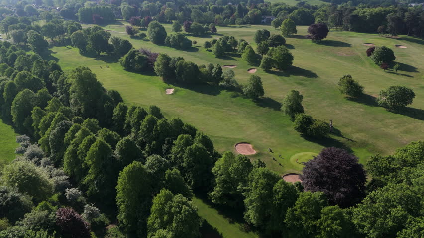Nottingham, UK, 12-05-2025: Aerial views of people playing golf at Wollaton Park Golf Course on the grounds of Wollaton Hall and Deer Park in Nottingham.