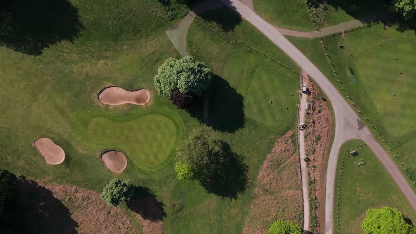 Nottingham, UK, 12-05-2025: Aerial views of people playing golf at Wollaton Park Golf Course on the grounds of Wollaton Hall and Deer Park in Nottingham.