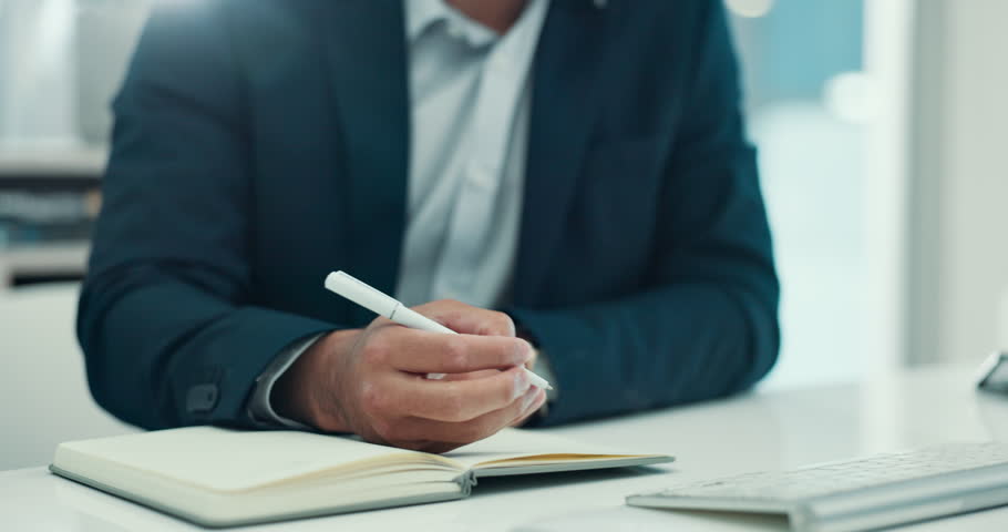 Hands, writing and book at office with notes, planning and review for wealth management at company. Person, broker or financial advisor with checklist, report and research for investment at agency