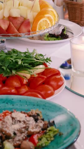 A festive table with plenty of food and drinks during a banquet. Delicious dishes at a wedding and decor