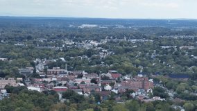 Aerial view of Martinsburg, West Virginia downtown. Red brick buildings, historic architecture and surrounding green trees on cloudy day. Small American city landscape. Wide shot. Fall season. - Powered by Shutterstock - Get 15% off with code: PIKWIZARD15