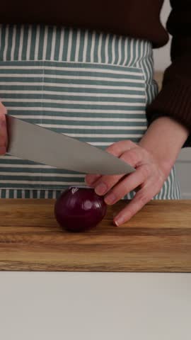 slicing red onions with knife cooking food