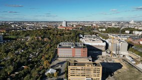 biggest data center building providing cloud computing services in an urban city. blockchain digital database, internet security for sensitive data. Best aerial view flight panorama orbit drone - Powered by Shutterstock - Get 15% off with code: PIKWIZARD15