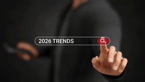 Businessman searching 2026 trends on virtual screen. AI, cybersecurity, e-commerce, automation, blockchain, finance, healthcare, remote work, biotechnology, sustainability, green business. 3D video - Powered by Shutterstock - Get 15% off with code: PIKWIZARD15