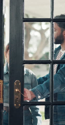 Front door, smile and moving with couple in new home for mortgage, homeowner and property. Real estate investment, happy and support with man and woman in living room of house for relocation