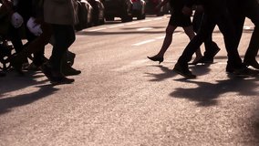 Pedestrians in a Crosswalk. A crowd of people crossing the street at a pedestrian crossing in the backlit sunlight - Powered by Shutterstock - Get 15% off with code: PIKWIZARD15