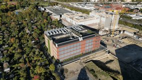 biggest data center building providing cloud computing services in an urban city. blockchain digital database, internet security for sensitive data. Perfect aerial view flight panorama orbit drone - Powered by Shutterstock - Get 15% off with code: PIKWIZARD15