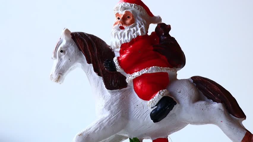 A jolly Santa Claus rides a horse, perfect for holiday scenes or winter illustrations.