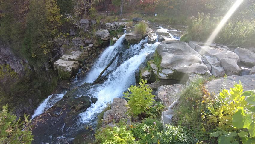 The top view of the waterfalls overlooking vibrant fall foliage at Chittenango Falls State Park, Madison County, New York, U.S.A